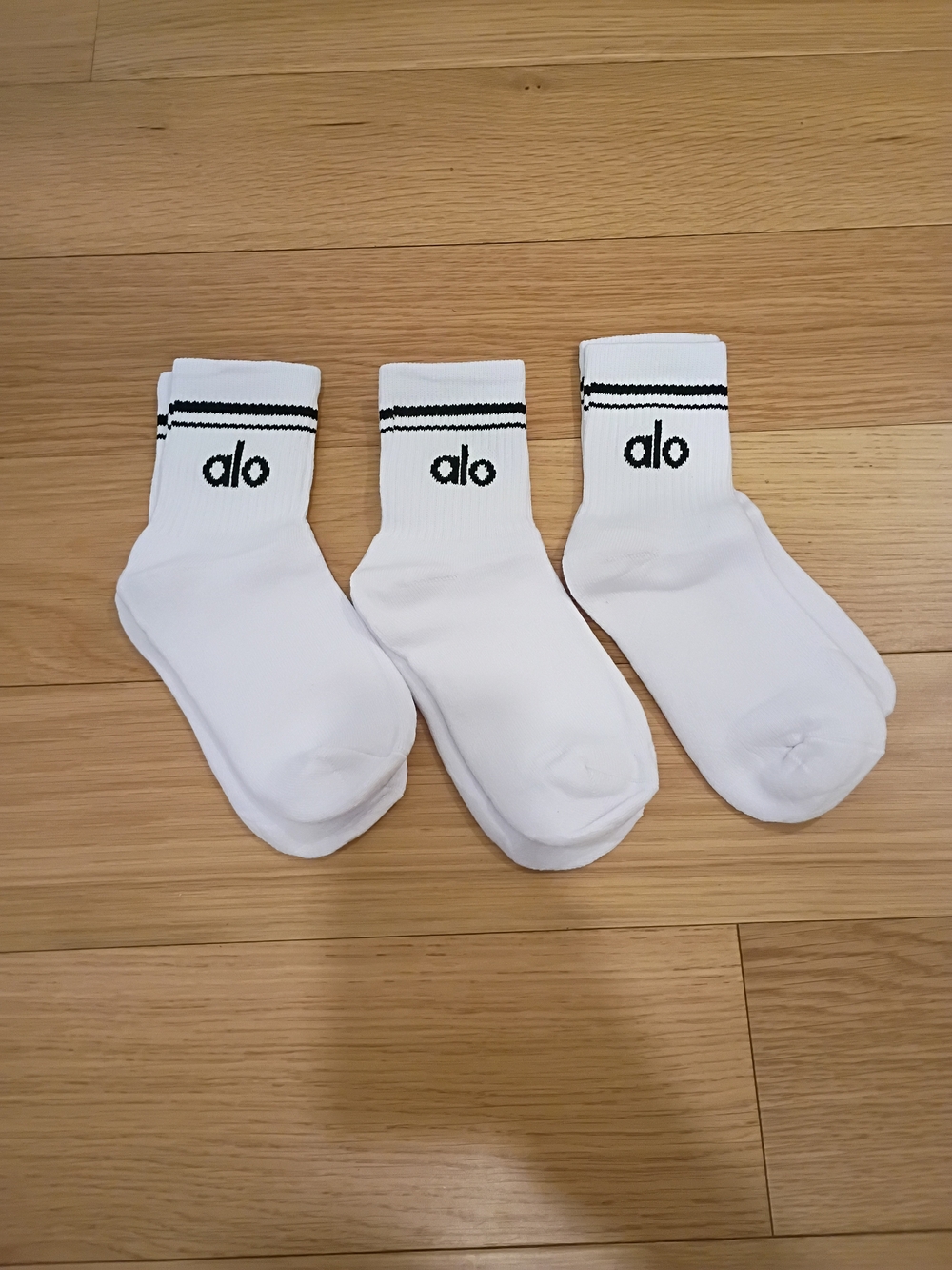 ALO Yoga 4 Half Crew White Socks with Black Logo and Stripes